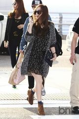 组图：少女时代飞新加坡开个唱 秋装时尚随性