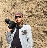 组图：宋祖英亲弟弟近照曝光 惬意游海南岛