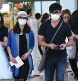 组图：甜蜜升级！吴奇隆刘诗诗手牵手现身机场