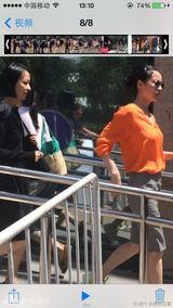 组图：王菲李亚鹏出席嫣然活动 橘色衬衣抢眼