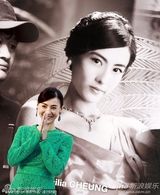 组图：张柏芝亮相变握手会 绿裙优雅难掩膝盖伤痕