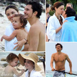 超模可儿携夫抱子海边拥吻 布鲁姆现吻痕(图)