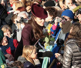 高清图：英国王室圣诞节现身教堂凯特帽子抢眼