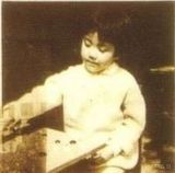 幻灯组图：王菲幼年生活照 泛黄照片现天后幸福童年