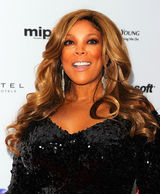 组图：Lady Gaga身着怪异镂空裙助阵国际艾美奖