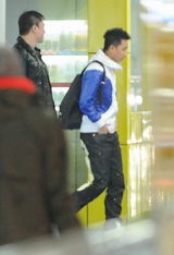 高清组图：韩庚低调秘密回京 机场“放空”