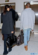 组图：卡戴珊肉色衣打底似没穿 老公贴心拎大包