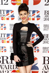 高清图：维多利亚-嘉丝蒂黑色短裙亮相身材窈窕