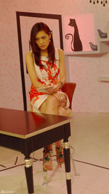 幻灯图：孟广美主持节目 时尚扮相带动收视