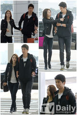 组图：韩惠珍奇诚庸现身机场秀甜蜜恩爱